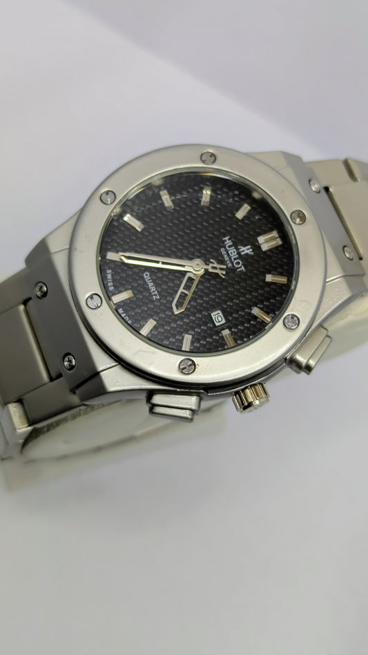 Hublot Genève – Silver with Black Dial.